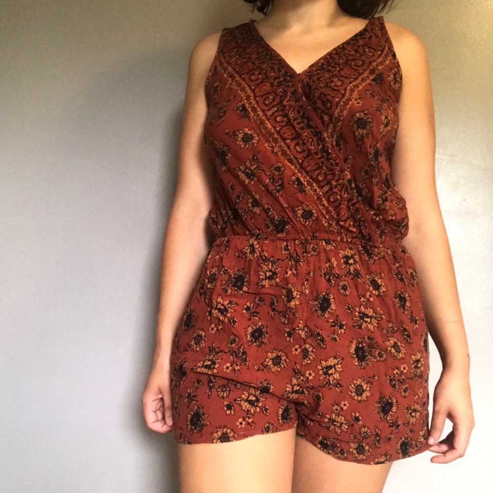 Sunflower Romper on a Rust Orange Background
